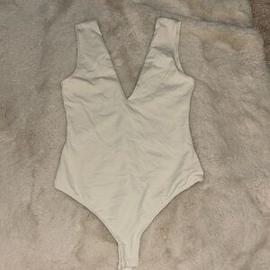 White thong body suit